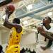 Ypsilanti junior Jaylen Johnson shoots while Huron senior Nasheed Bass tries to defend in the game on Friday, March 8. Daniel Brenner I AnnArbor.com